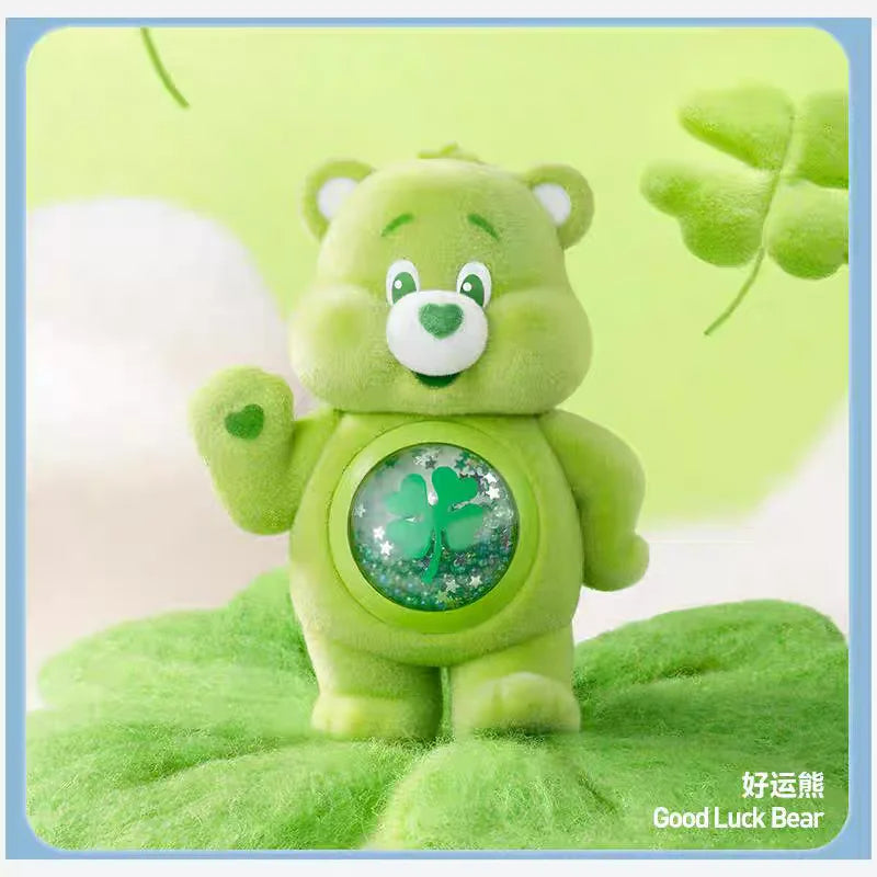 A green Care Bear figurine with a smiling face sitting on a bright green leaf.