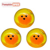 Three yellow pumpkin head squishy stress relief toys