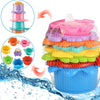 Colorful stacking cups bath toys with floating boats stacked in a blue container
