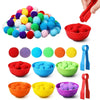 A collection of colorful pom-poms in various colors and sizes, including red, blue, green, yellow, and purple, presented in b