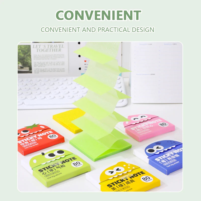 A collection of colorful sticky notes in various shades of green, yellow, and pink are displayed on a white desk next to a la