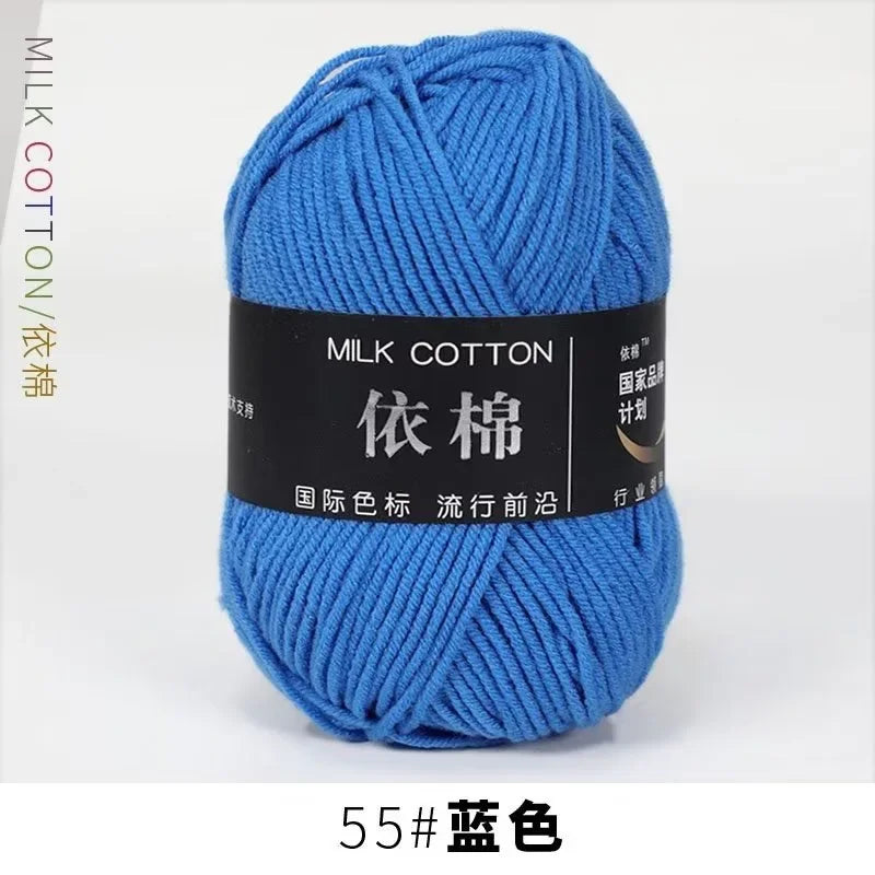 A skein of bright blue milk cotton yarn labeled 55# in a ball for knitting and crochet.