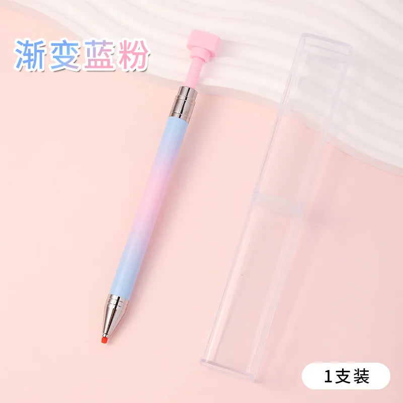 A gradient rotating dotting pen with a pink handle and clear body is shown next to its packaging.