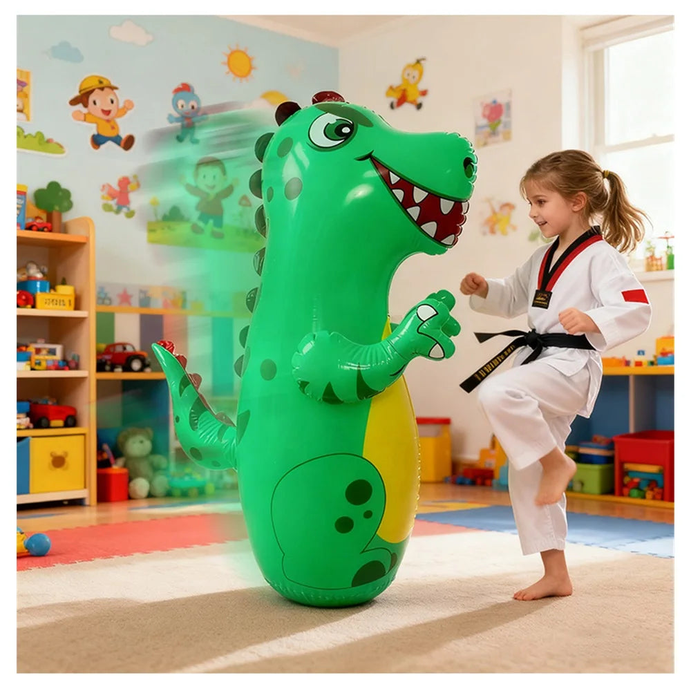 A large green inflatable dinosaur punching bag is positioned on a rug in a brightly lit room.