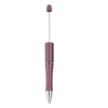 A silver and purple beadable ballpoint pen with a black ink tip.