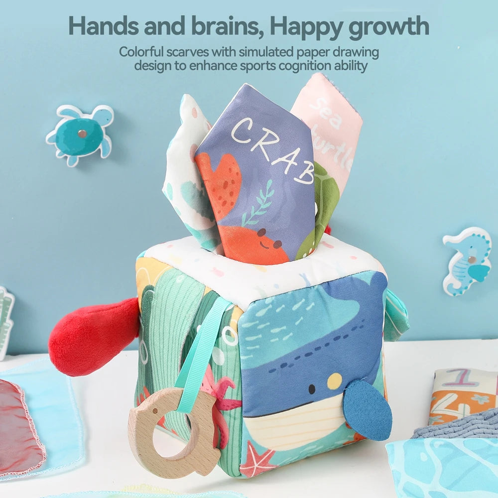 A colorful tissue box toy featuring a crab and a sea turtle design for baby's cognitive development.