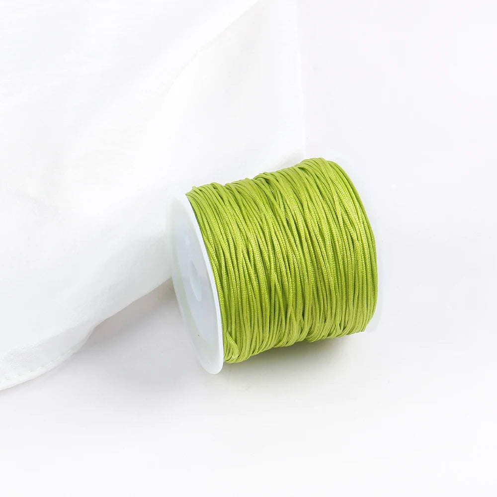 A roll of bright lime green macrame cord for jewelry making and crafts.