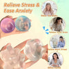 Hands squeezing clear silicone fidget balls to relieve stress, anxiety, and work tension.