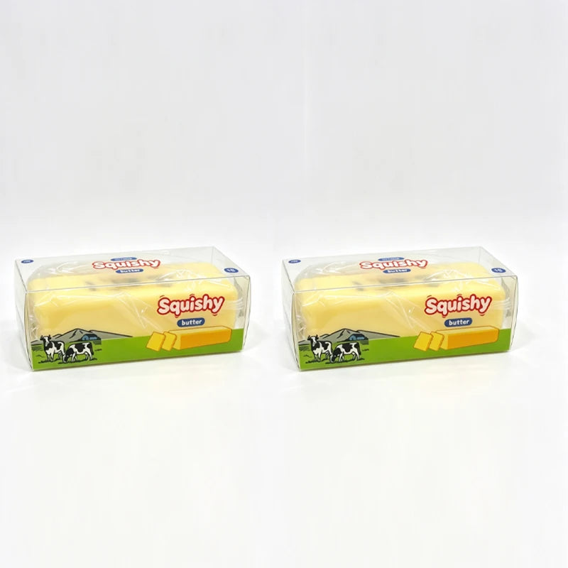 A clear plastic box of Squishy butter fidget toy with a yellow silicone product inside.