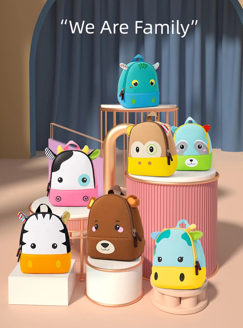 A collection of colorful 3D animal kids backpacks, including a blue dinosaur, yellow bear, and green panda, displayed on a wo