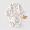 A white cotton long sleeve baby romper featuring a floral print of pink, purple, and orange flowers.
