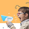 A boy is using a blue smart voice changer megaphone to make a loud sound.