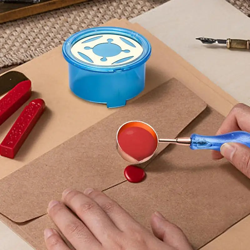 A hand is using a blue wax seal melting kit with a heater and spoon to melt red wax on brown paper.
