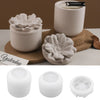 A set of white silicone floral molds for decorative storage jars and candle cups shown in various forms.