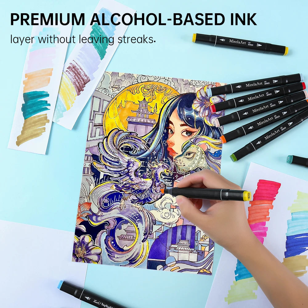 A hand is using a black alcohol-based ink marker to draw on colorful paper, surrounded by other markers.