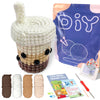 A beginner crochet kit for amigurumi animals showing a finished white animal and various yarn colors and tools.