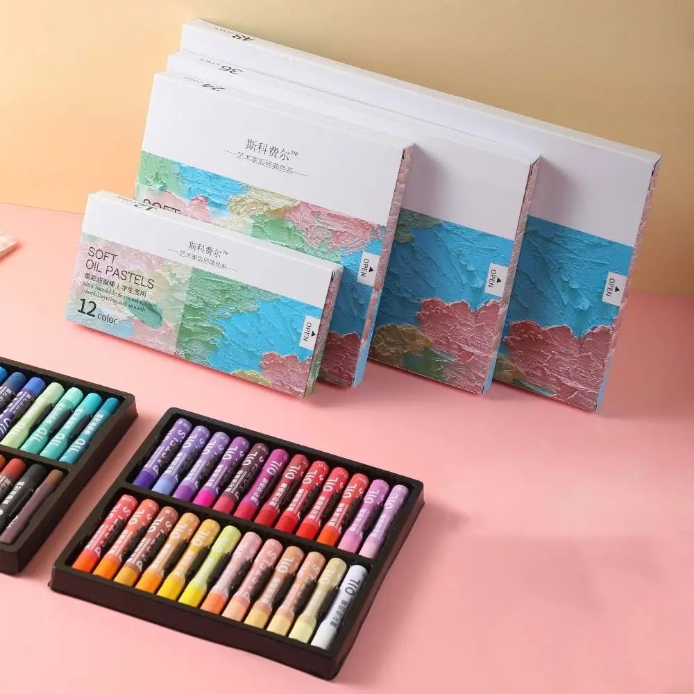 A set of Morandi Oil Pastels in soft macaron colors displayed in individual boxes and a wooden palette.