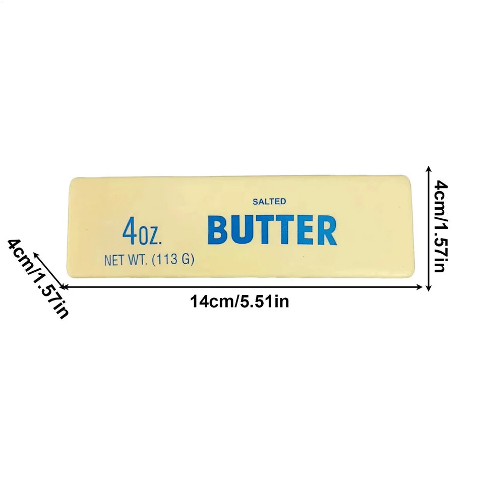 A rectangular yellow butter squishy stress relief toy labeled 4oz salted butter with dimensions 4cm x 1.57in.