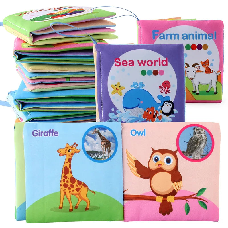 A collection of soft cloth books featuring various animals like a giraffe, owl, and sea creatures.