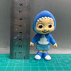 A playful cartoon PVC figurine of a child wearing a blue hooded outfit with a watermelon school bus design, measured against 