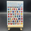 A sheet of decorative alphabet stickers featuring lowercase and uppercase letters, stars, and a cat design.