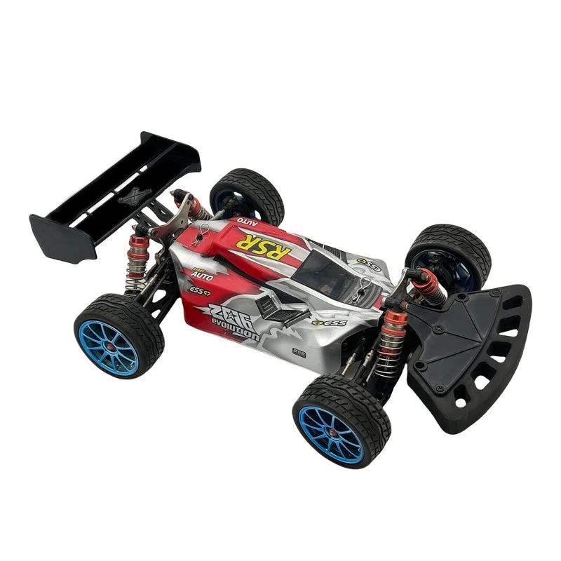 A red and silver hard tail wing upgrade for an RC car, featuring a large spoiler and specialized wheels.