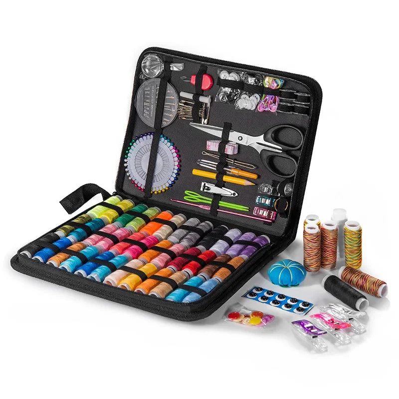 A black travel storage box containing a complete sewing kit with various tools and threads.