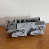 A gray LEGO model of an Imperial Troop Transport vehicle built from 697 building blocks.
