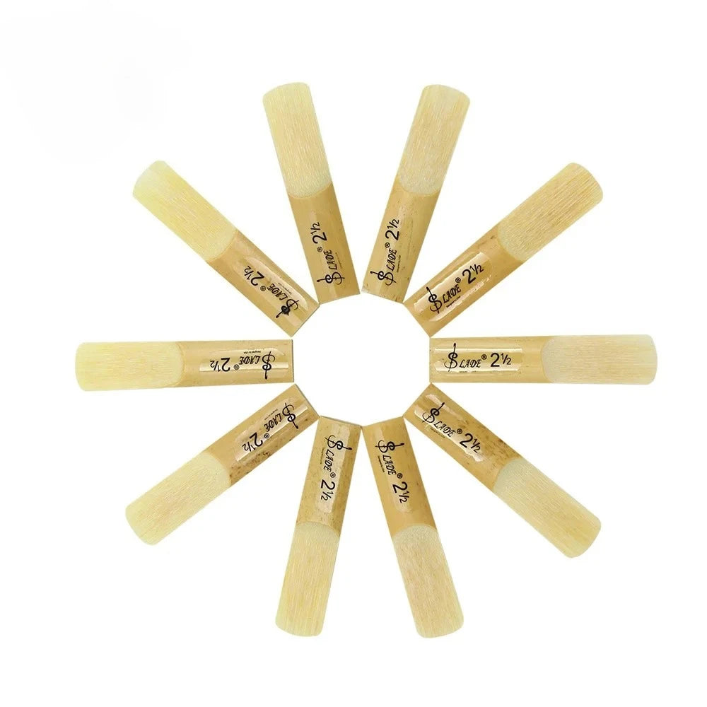 A collection of ten wooden clarinet reeds arranged radially around a central point.