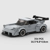 A gray classic rally car building block set with a black roof and large spoiler.