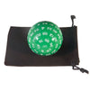 A green 60-sided polyhedral die is resting in a dark storage bag.