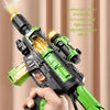 A hand holds a green and black mist-spraying light-and-sound toy gun with a yellow light effect.