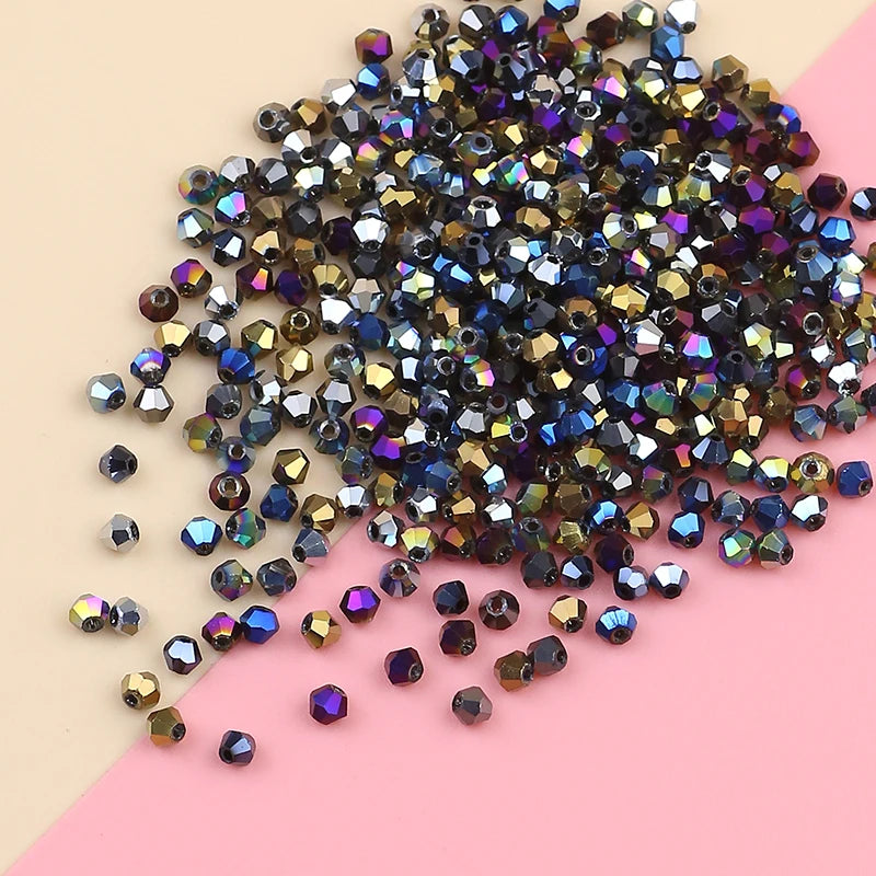 A pile of dark purple and bronze electroplated crystal glass beads for jewelry making