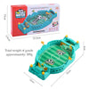 A green and blue tabletop foosball game box and assembled plastic soccer field set.