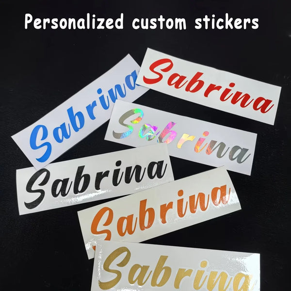 Several personalized custom stickers with the name Sabrina in various colors and finishes