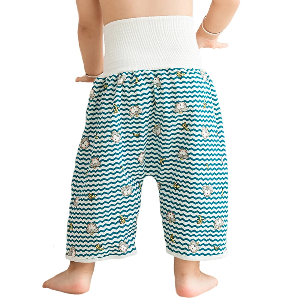 A baby wearing white absorbent diaper pants with a patterned skirt for potty training.