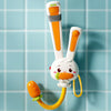 A white rabbit-shaped electric bath shower toy with orange accents and a yellow flexible tube.