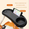 A black partition tray for a stroller holds food and a phone, designed to provide balanced nutrition.
