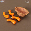 A set of miniature orange dollhouse vegetable baskets and handles in a woven texture.