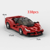 A red classic supercar model built from 338 interlocking plastic bricks.