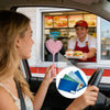 A woman in a car is holding a Tap to Pay card holder while looking at a man smiling inside a shop window.