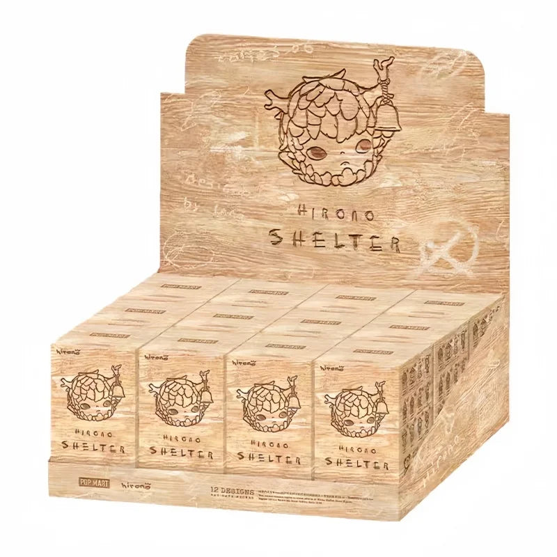 A box of Hirono Shelter collectible figurines featuring a stylized, monster-like face design.
