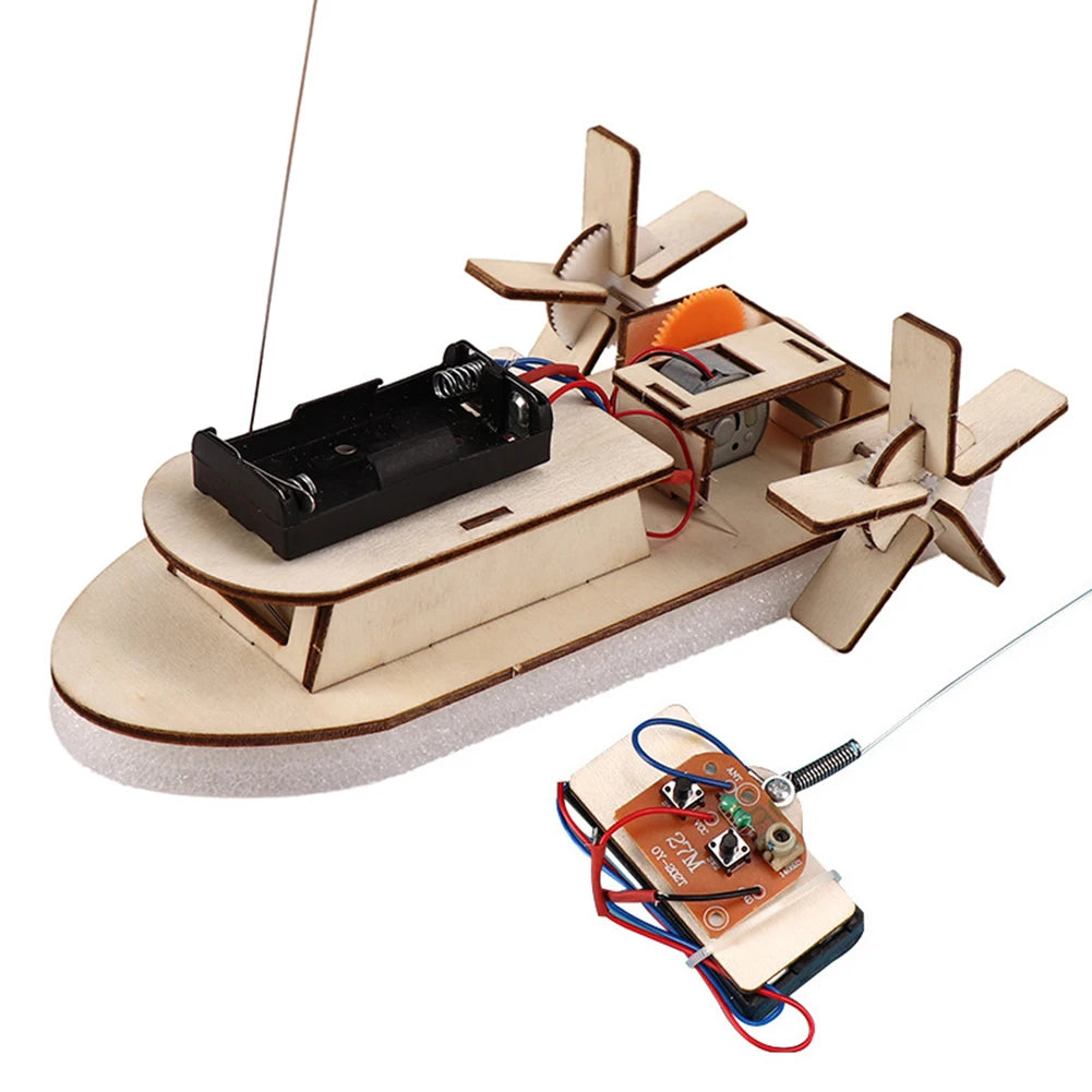 A DIY wooden paddle boat kit featuring a black boat, wooden paddle, and an electronic sensor setup for a STEM science experim