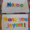 Magnetic alphabet spelling kit showing the name Norma and a thank you message for Joycat