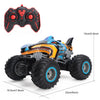 An orange and blue All-Terrain RC monster truck with large tires and a spray action feature.