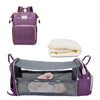 Purple multifunctional diaper bag backpack with an interior changing pad and storage compartments