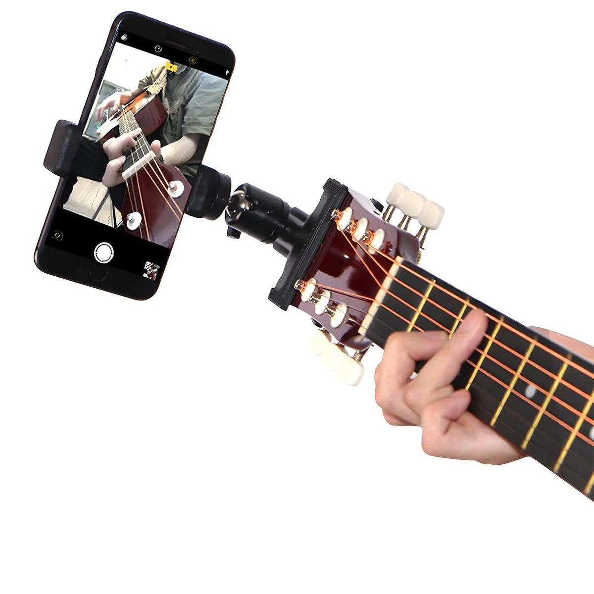 A hand holds a guitar with a 360° rotating phone mount attached for live streaming or recording.