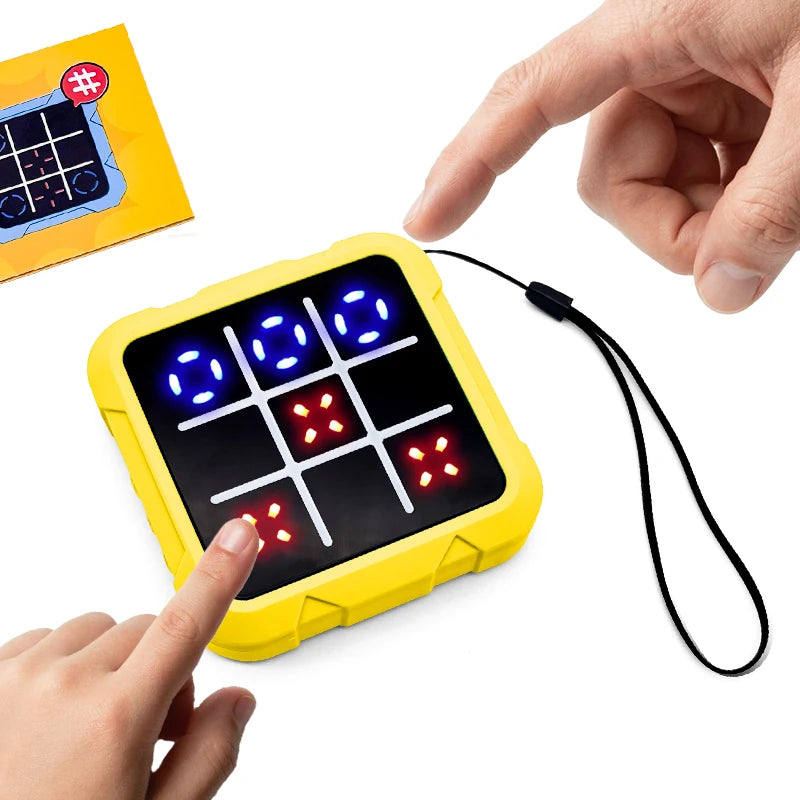 A hand is interacting with a yellow electronic tic tac toe game board displaying colored lights.