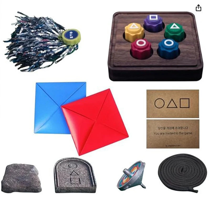 A set of traditional Korean Gonggi stones including pebbles, a string, and various colored stones for a game.