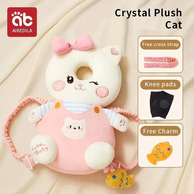 A white cat plush toy with pink accents and a cross strap, knee pads, and charm attached.
